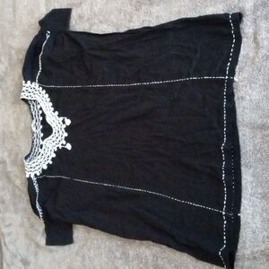 Matta black tunic minidress with lace collar and tassels